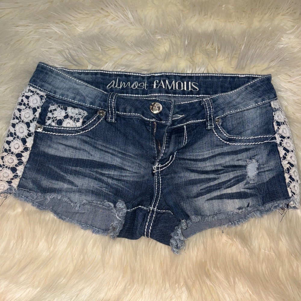 Almost Famous Women's Distressed Blue Jean Shorts with Lace